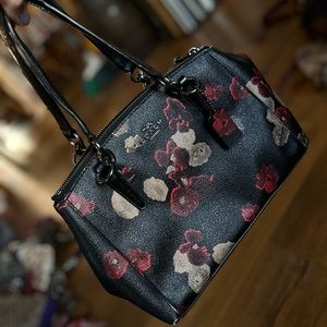 Red and tan floral black Coach purse